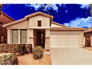 Inviting single-Gathering home with a two-car garage, desert landscaping, and a covered entrance at 2242 W Calle Marita --, Phoenix, AZ 85085