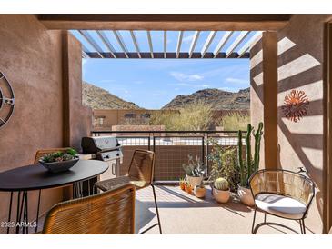 Inviting patio area with mountain views, a grill, and comfortable seating under a pergola at 36600 N Cave Creek Rd # 9B, Cave Creek, AZ 85331