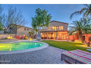 Beautiful backyard pool and lounge area, perfect for relaxing and entertaining at 188 E Mountain View Rd, San Tan Valley, AZ 85143