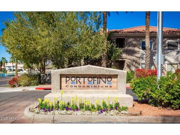 Portofino Condominiums entrance sign beautifully landscaped with colorful flowers at 3830 E Lakewood Pkwy # 3164, Phoenix, AZ 85048