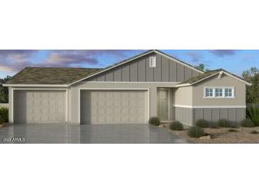 Charming single-Gathering home with a three-car garage and a welcoming entrance at 16753 W Whispering Wind Dr, Surprise, AZ 85387