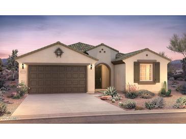 Charming single-story home with a desert-landscaped front yard and a two-car garage at 21288 N 272Nd Ln, Buckeye, AZ 85396