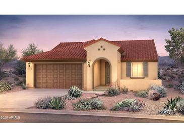 Charming single-story home featuring a clay tile roof, arched entry, and a two-car garage at 26656 W Kimberly Way, Buckeye, AZ 85396
