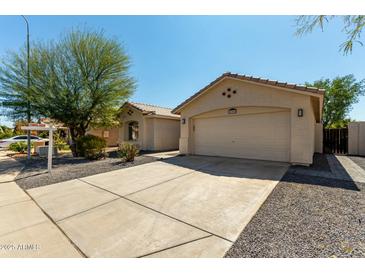 Charming single-story home with a neutral color scheme, desert landscaping, and a two-car garage at 399 W Buena Vista Dr, Tempe, AZ 85284