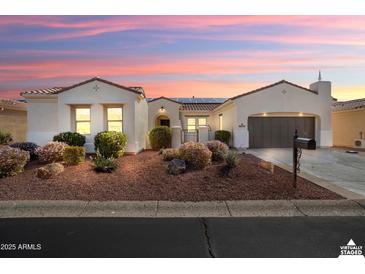 Charming single story home featuring a well-maintained yard with decorative rock and desert landscaping at 23123 N Cardenas Dr, Sun City West, AZ 85375