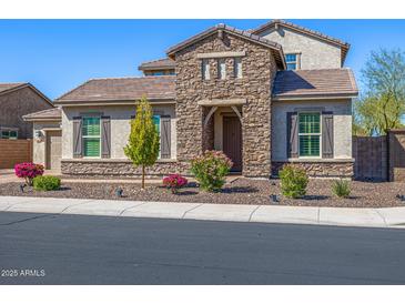 Charming single-Gathering home featuring a stone facade and landscaped front yard at 10110 W El Cortez Pl, Peoria, AZ 85383