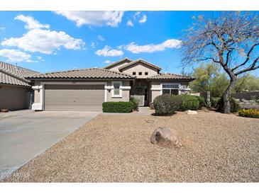 Charming single story home with a two car garage and low maintenance desert landscaping at 10588 E Tierra Buena Ln, Scottsdale, AZ 85255