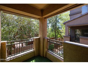 Enjoy the view from this comfortable covered balcony with mature landscaping and outdoor views at 16825 N 14Th St # 34, Phoenix, AZ 85022