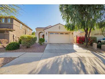 Charming single-story home featuring a two-car garage, desert landscaping, and a welcoming entryway at 3890 S Star Canyon Dr, Gilbert, AZ 85297