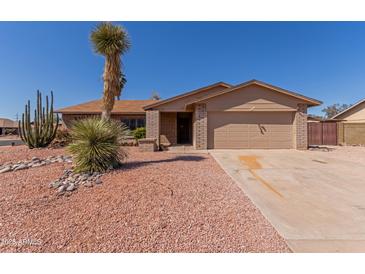 Charming single-story home featuring desert landscaping and an attached two-car garage at 6534 S Marilyn Ann Dr, Tempe, AZ 85283