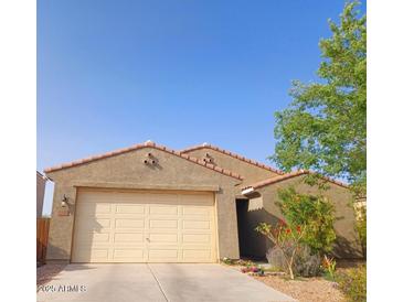 Charming single-story home featuring a two-car garage and desert landscaping at 1280 W Blue Ridge Dr, San Tan Valley, AZ 85140