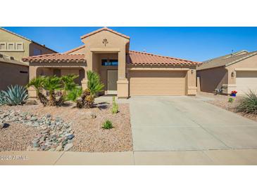 Charming single-story home with desert landscaping, tile roof, and two-car garage in a desirable location at 22499 N Dietz Dr, Maricopa, AZ 85138