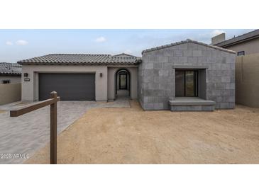 Charming single story home featuring gray stone driveway and tile roof at 12326 E Black Rock Rd, Scottsdale, AZ 85255