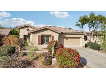 Charming single-story home with a two car garage and desert landscaping at 2534 W Muirfield Dr, Anthem, AZ 85086