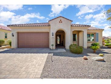 Charming single-story home featuring a well-manicured yard and a welcoming covered entrance at 26797 W Sierra Pinta Dr, Buckeye, AZ 85396