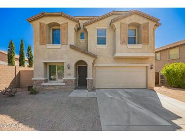 Charming two-story home featuring a two-car garage and desert landscaping at 4617 S Carmine --, Mesa, AZ 85212