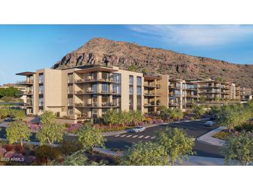 Stunning exterior view of condos with mountain views and desert landscaping in a vibrant community at 4849 N Camelback Ridge Rd # B104, Scottsdale, AZ 85251