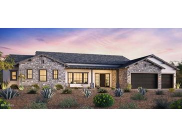 Beautiful single-story home featuring a stone facade, two-car garage, and desert landscaping at 4329 S Parkcrest St, Gilbert, AZ 85297