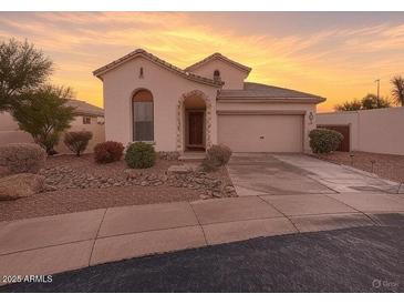Charming single-story home featuring a landscaped front yard and an attached two-car garage at 6279 S Martingale Ct, Gilbert, AZ 85298
