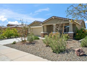 Charming single-story home featuring a low maintenance yard and a two-car garage at 11910 E Amanda Rd, Gold Canyon, AZ 85118