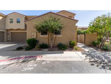 Charming home exterior with a secure gated entrance and well-maintained landscaping at 1367 S Country Club Dr # 1295, Mesa, AZ 85210