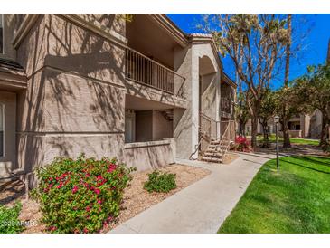 Inviting multi-level apartment with private balconies surrounded by lush landscaping and walkway at 17017 N 12Th St # 2012, Phoenix, AZ 85022