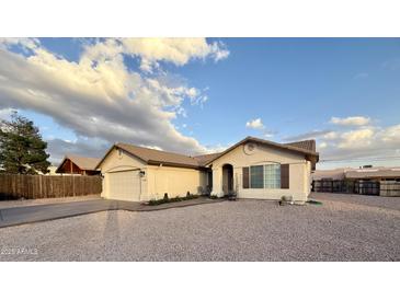 Inviting single-Gathering home with a two-car garage, offering desert landscaping and a serene residential setting at 10241 E La Palma Ave, Gold Canyon, AZ 85118