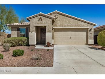 Charming single-story home featuring a tile roof and low-maintenance desert landscaping at 10454 W Maya Way, Peoria, AZ 85383