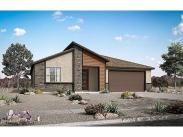 Stunning single-story home featuring a modern design, desert landscaping, and attached two-car garage at 25727 N 147Th Dr, Surprise, AZ 85387