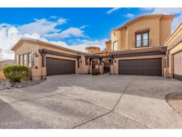 Gorgeous desert home featuring multiple garages, beautiful architecture and landscaping at 5370 S Desert Dawn Dr # 30, Gold Canyon, AZ 85118