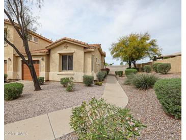 Charming single-Gathering home with desert landscaping, gravel, and a paved walkway to the front door at 5415 E Mckellips Rd # 104, Mesa, AZ 85215