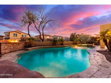 Sparkling swimming pool surrounded by lush landscaping, creating a private backyard retreat at 1147 E Lodgepole Dr, Gilbert, AZ 85298