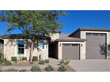 Beautiful single-Gathering home featuring a desert-landscaped front yard and an attached two-car garage at 27629 N 176Th Dr, Surprise, AZ 85387