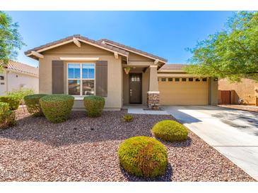Charming single-story home featuring a well-manicured front yard and a two-car garage at 2831 W Carson Rd, Phoenix, AZ 85041