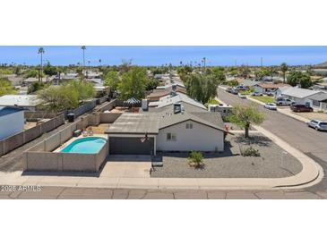 Charming home with a private pool, fenced yard, and desert landscaping in a quiet neighborhood at 3405 S Cutler Dr, Tempe, AZ 85282