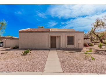 Charming single-story home with a desert landscape and a red tile roof at 1342 W Emerald Ave # 381, Mesa, AZ 85202