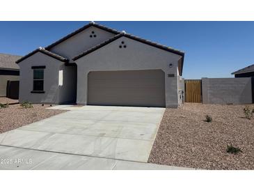Charming single-story home featuring a spacious driveway and low-maintenance desert landscaping at 3945 E San Jose St, San Tan Valley, AZ 85143