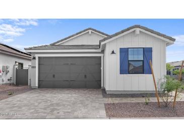 Charming single-Gathering home featuring a neutral color palette and a two-car garage at 4383 N 203Rd Dr, Buckeye, AZ 85396