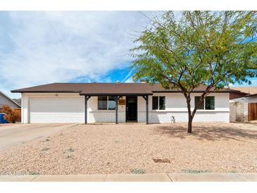 Charming single-story home with a well-maintained front yard and desert landscaping at 10428 S 43Rd St, Phoenix, AZ 85044