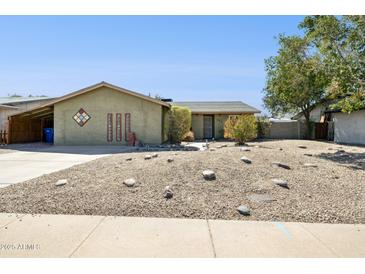 Charming single-story home with desert landscaping and a welcoming facade at 153 W Hillside St, Mesa, AZ 85201
