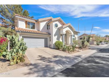 Charming two-story home features a grey garage door, barrel tile roof, and desert landscaping at 3932 W Rene Dr, Chandler, AZ 85226