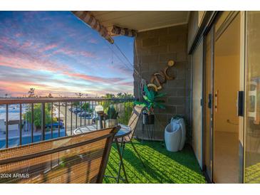 Cozy balcony with a chair and table perfect for enjoying sunrise and sunset views at 425 S Parkcrest Dr # 334, Mesa, AZ 85206