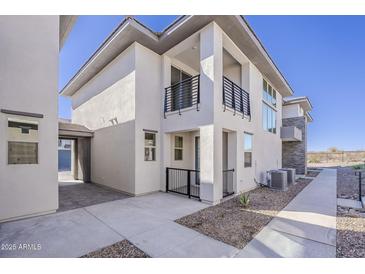 Modern two-story home featuring clean architectural lines and a private balcony at 2121 W Sonoran Desert Dr # 21, Phoenix, AZ 85085