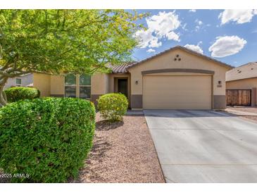Charming single-story home with a well-maintained landscaped front yard and concrete driveway at 2167 W Ethan Ct, San Tan Valley, AZ 85144