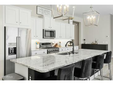 Stylish kitchen features granite counters, stainless appliances, and pendant lighting at 1816 N Bernard Cir, Mesa, AZ 85207