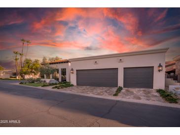 Charming home featuring desert landscaping, a two-car garage, and a beautiful terracotta tile roof at 2421 E Montebello Ave, Phoenix, AZ 85016