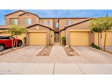Inviting townhome with a private courtyard entry and two-car garages at 250 W Queen Creek Rd # 206, Chandler, AZ 85248