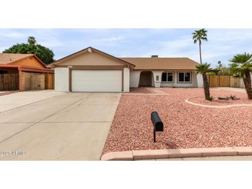 Charming single-story home with a two-car garage and desert landscaping at 16010 N 47Th Dr, Glendale, AZ 85306