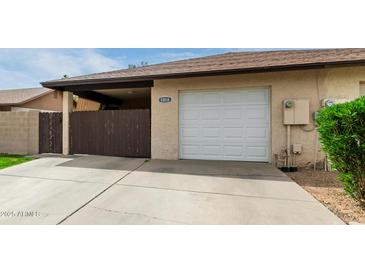 Single car garage with a quaint driveway and fenced courtyard for added privacy at 1818 S Toltec --, Mesa, AZ 85204