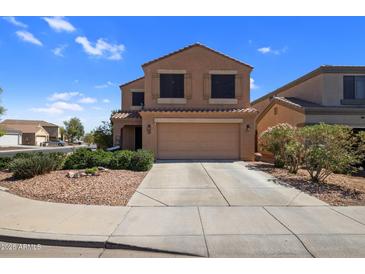 Two story home with a tile roof, covered porch, and two car garage at 23945 N Pablo N Ct, Sun City, AZ 85373